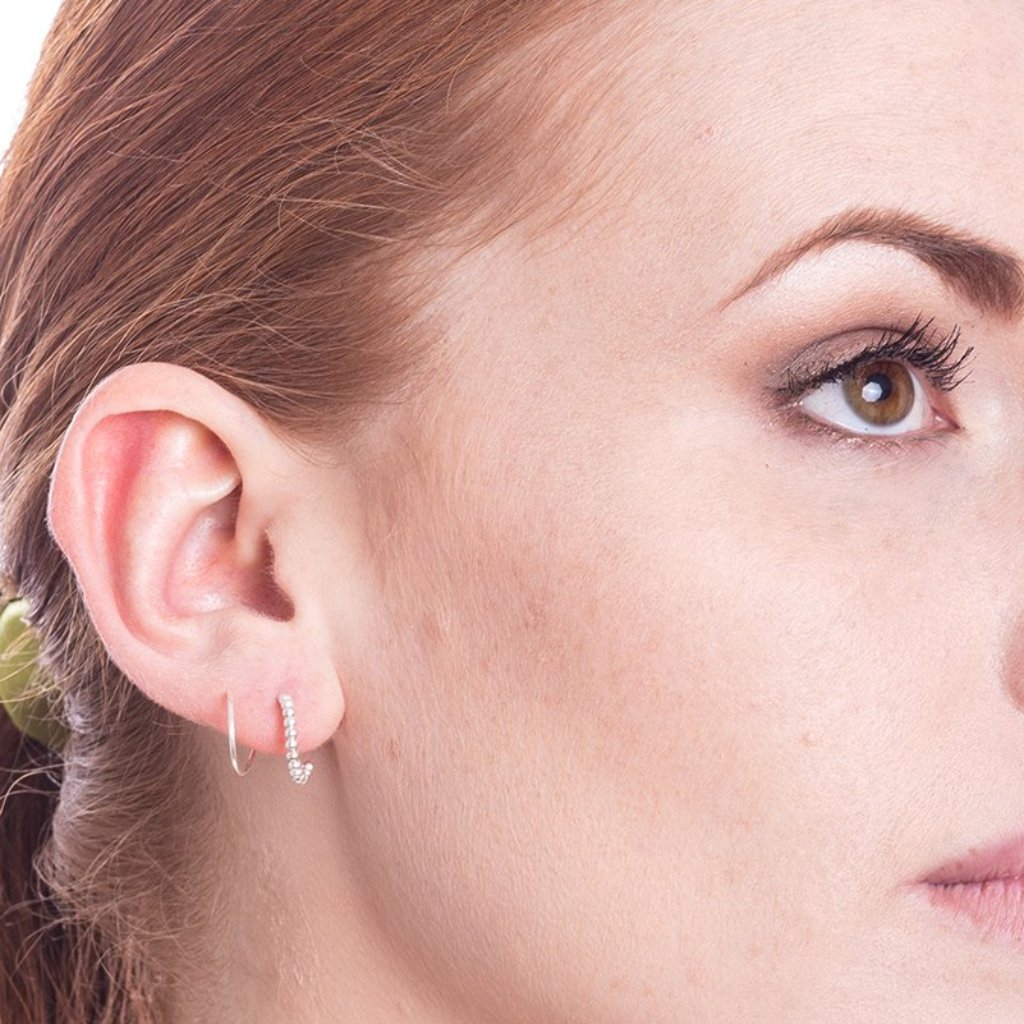 Spiral piercing ear top