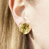 Gold Wavy Textured Disc Clip On Stud Earrings