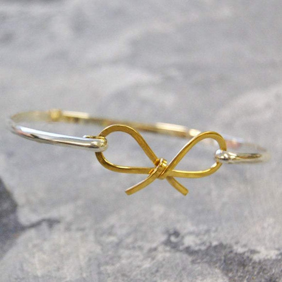 Sterling Silver And Gold Bow Bangle